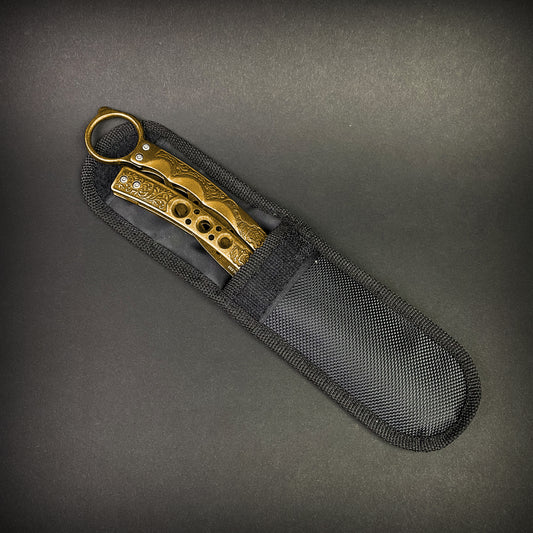 Guild Arms gold butterfly trainer knife with decorative handle in black protective nylon sheath