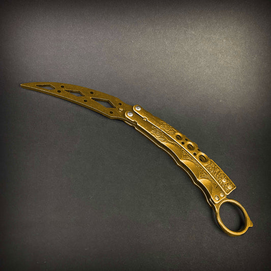 Guild Arms gold butterfly trainer knife with intricate design on blade and handles