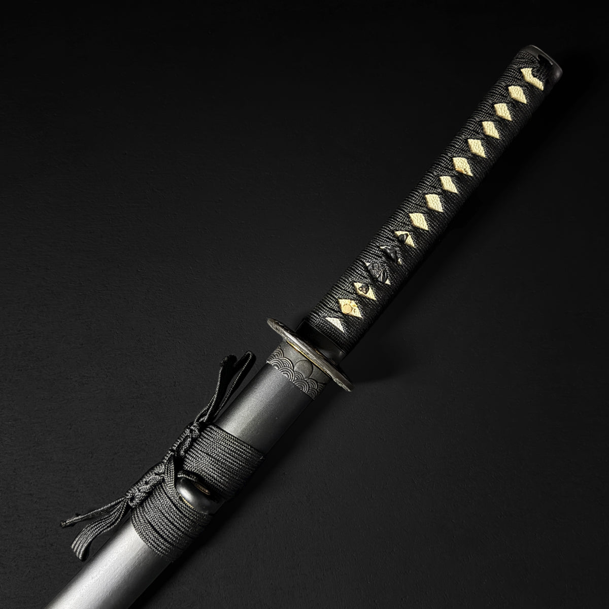 Black katana hilt with gold accents | Guild Arms