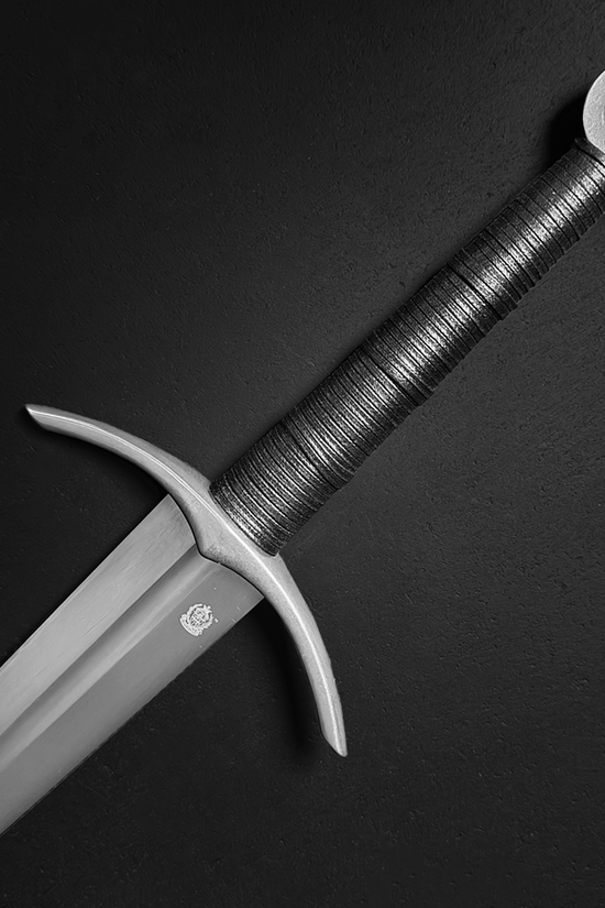 Hand-forged 1060 steel bastard sword with black scabbard