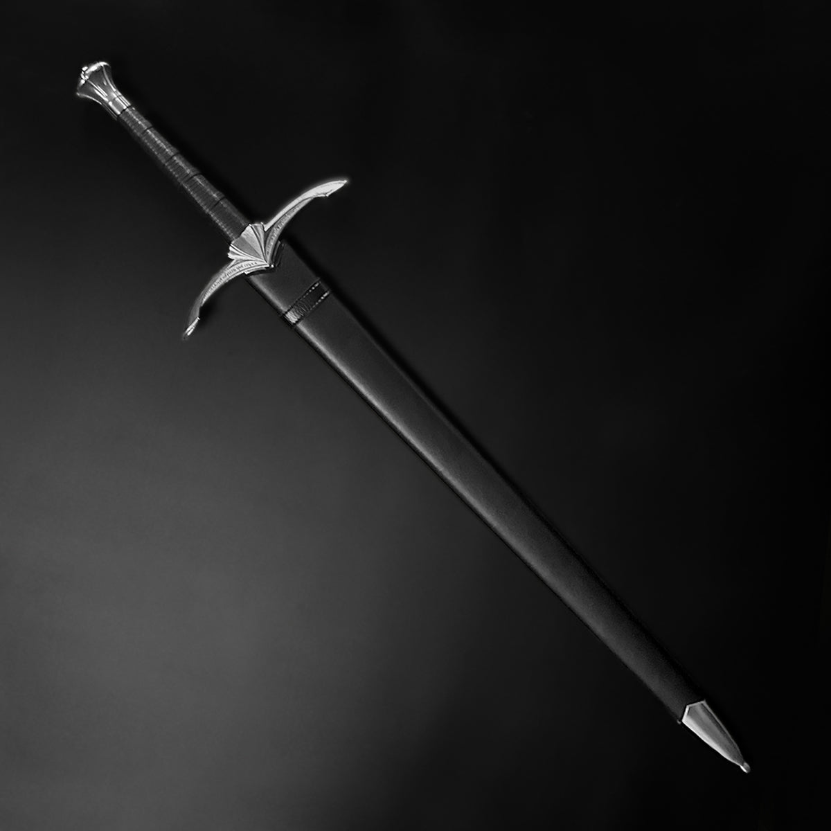 A medieval longsword inside a black scabbard - Guild Arms.