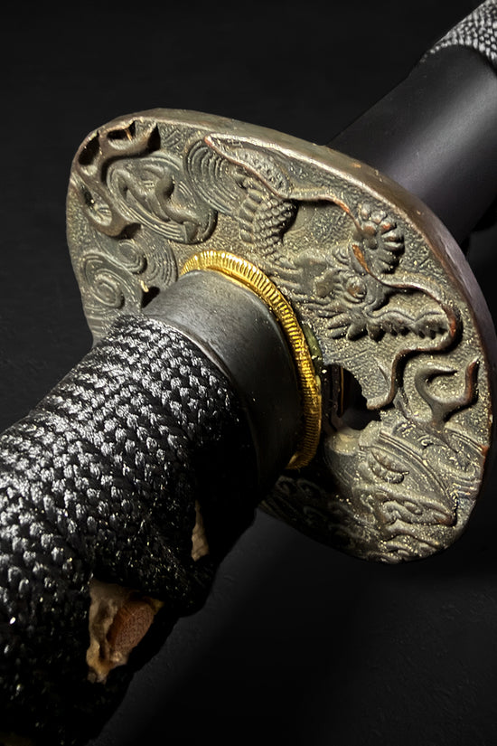 Katana hilt featuring detailed dragon tsuba. | Guild Arms