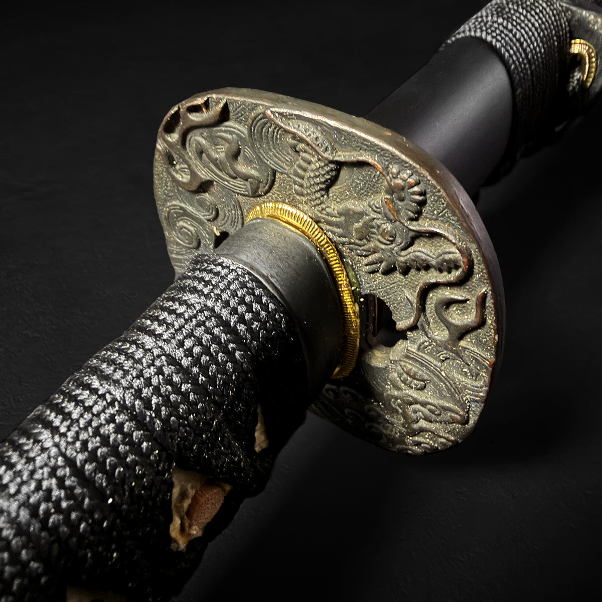Katana hilt featuring detailed dragon tsuba. | Guild Arms