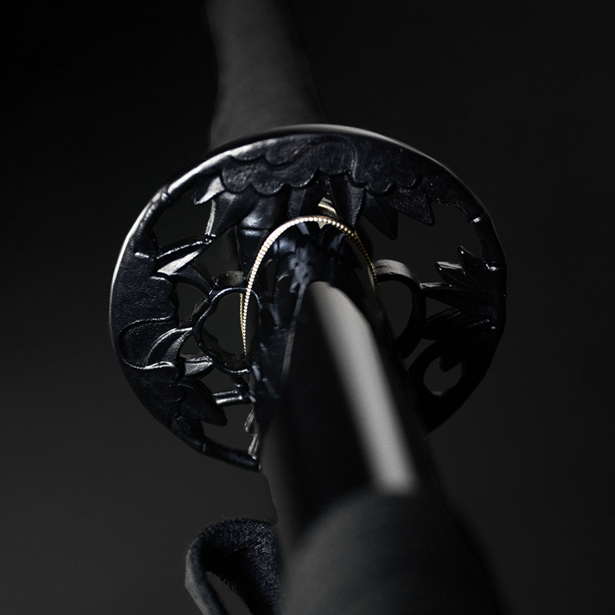 Black katana tsuba guard closeup- Guild Arms.
