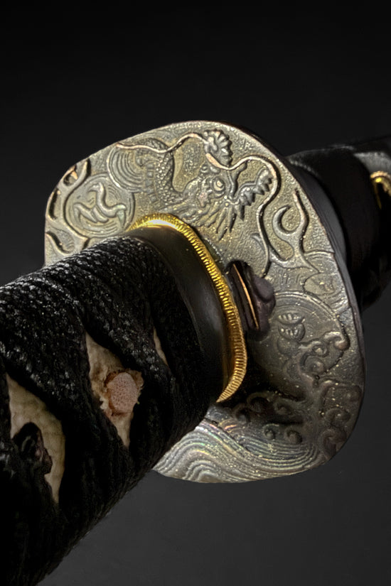 Katana guard and wrapped hilt close-up. | Guild Arms