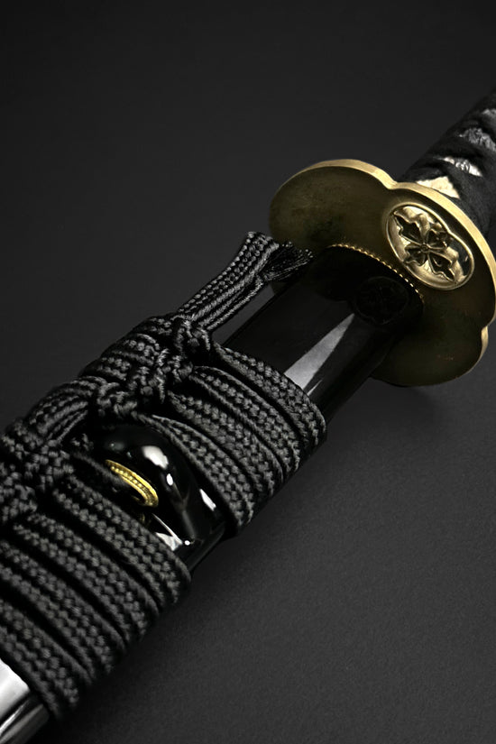 Black Japanese katana with gold guard.  | Guild Arms  