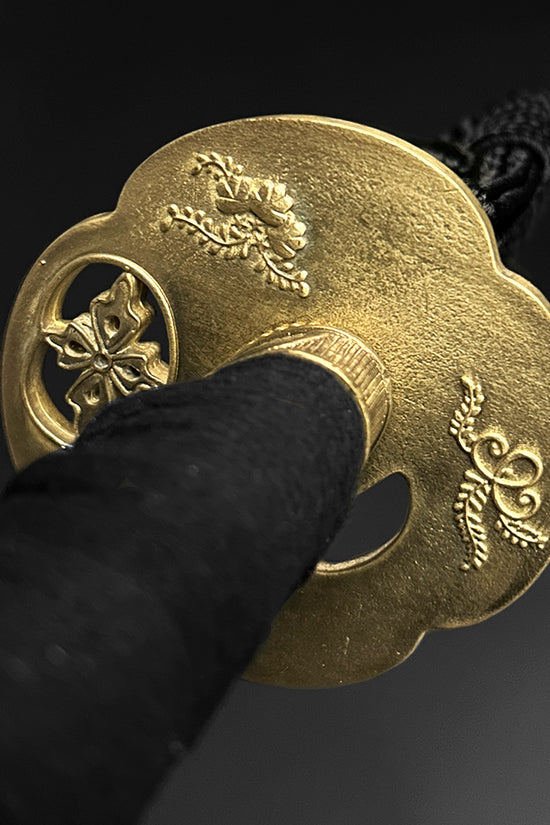 Gold katana hand guard with carvings. | Guild Arms 