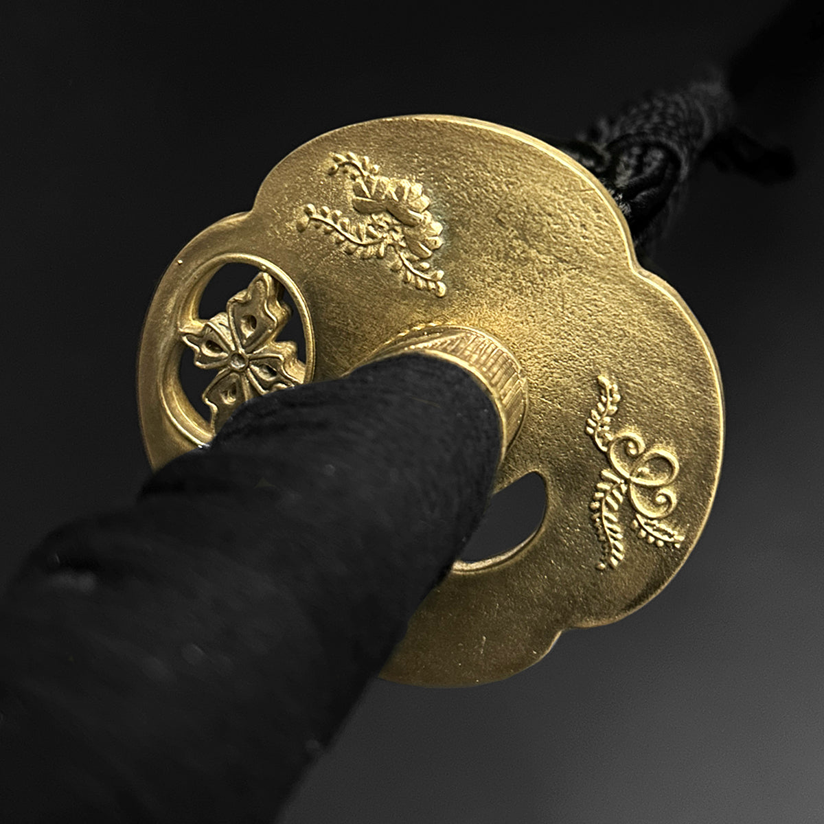 Gold katana hand guard with carvings. | Guild Arms 