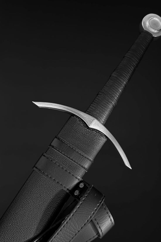 Medieval bastard sword with leather-wrapped grip and crossguard