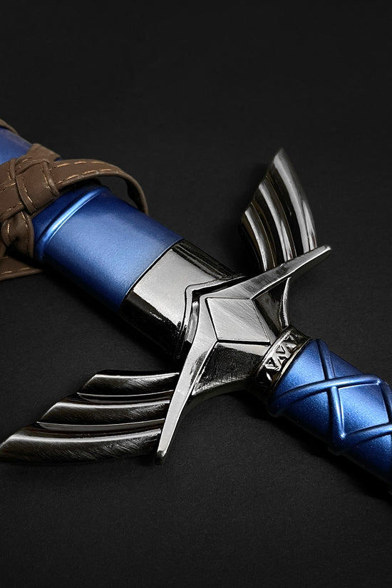 Engraved wing guard on blue sword handle