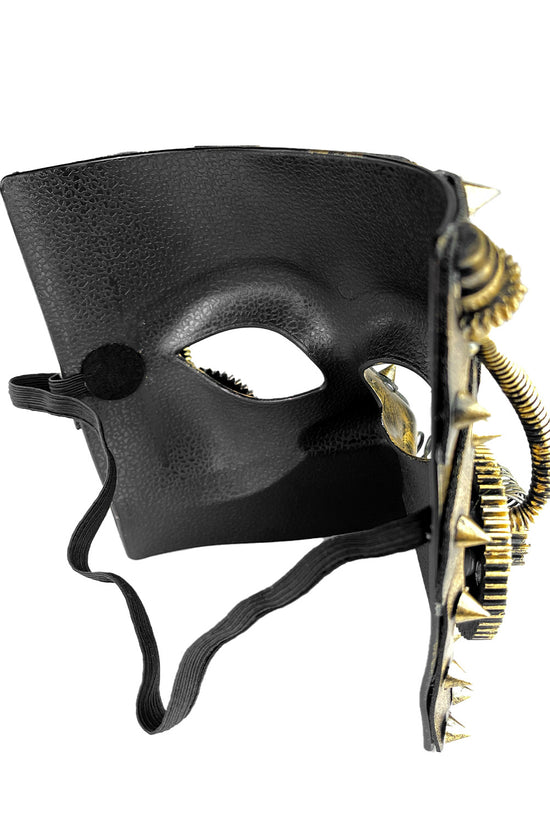 This image shows the interior, textured black reverse side of a steampunk-style masquerade mask.