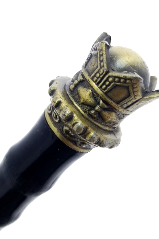 Close-up of golden crown dagger pommel