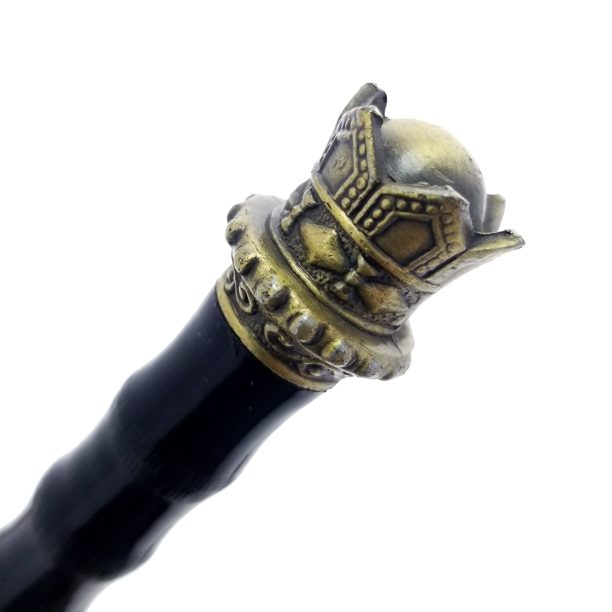 Close-up of golden crown dagger pommel