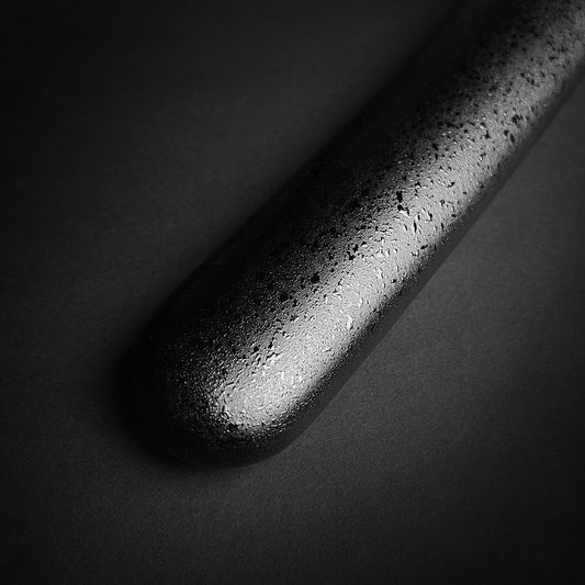 Close-up of textured black metal handle