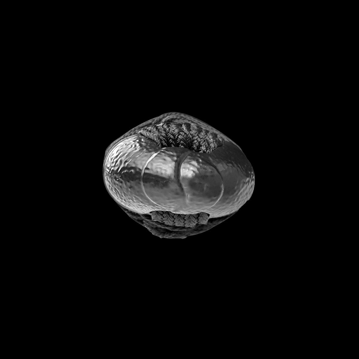 A single metallic round bead- Guild Arms.