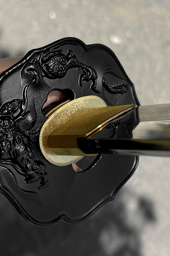 A close-up of a katana's tsuba - Guild Arms.