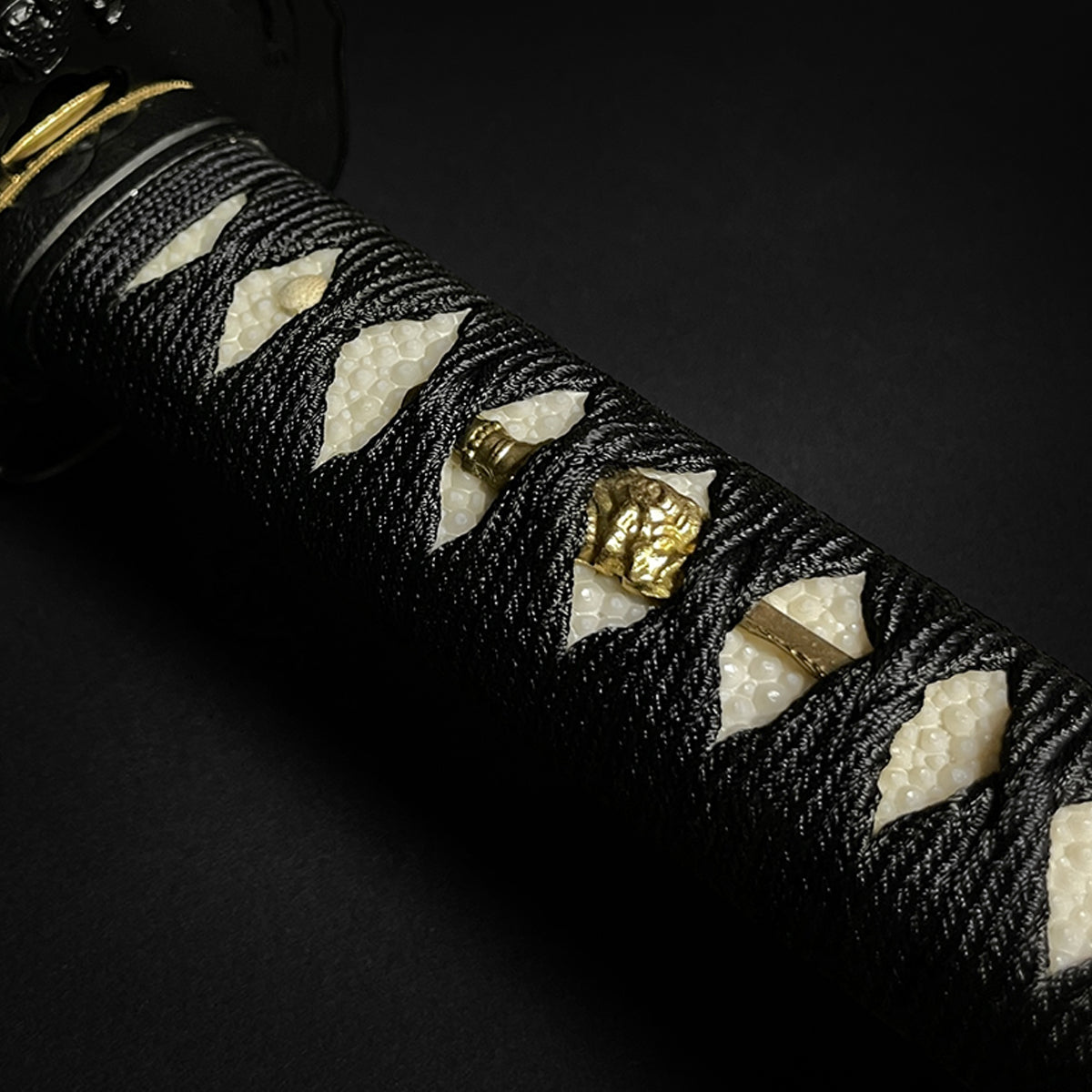 Japanese katana sword hilt closeup- Guild Arms.