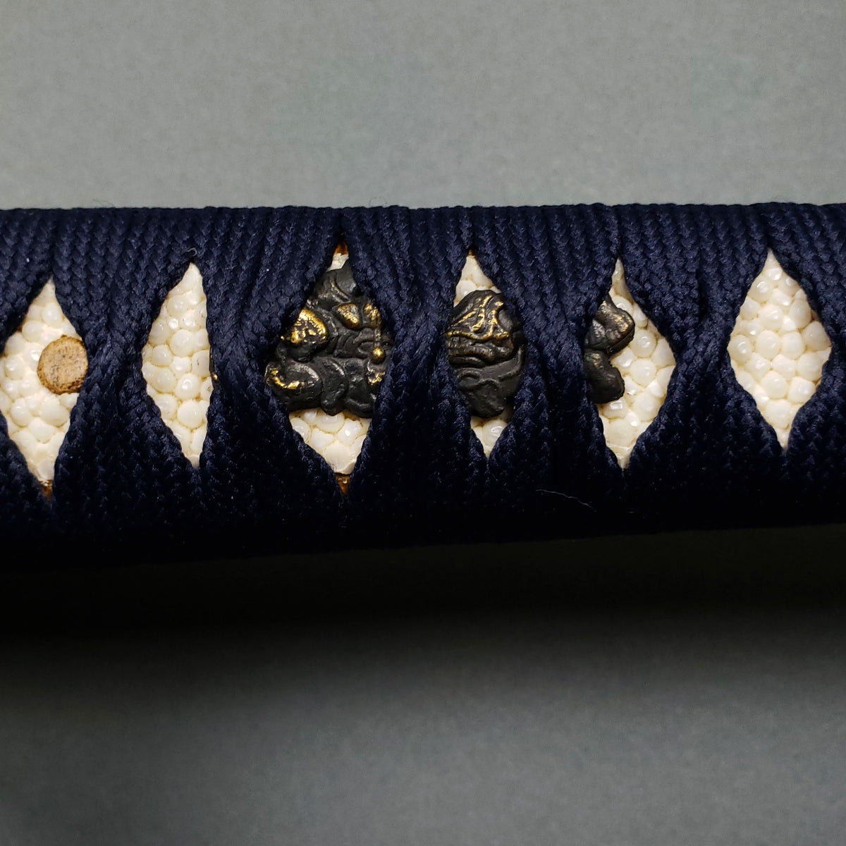 Katana hilt wrapping closeup- Guild Arms.