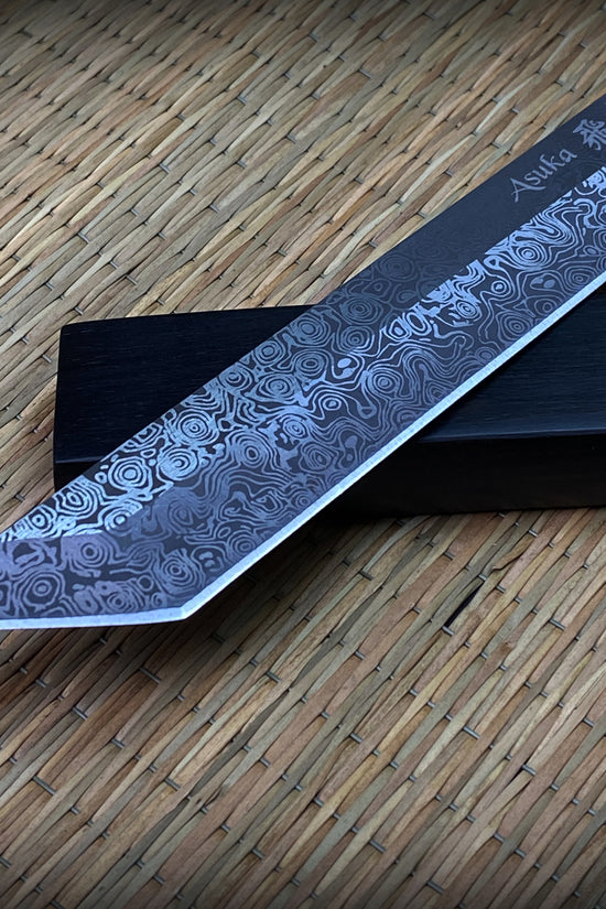 Asuka Suterusu Modern Tanto Knife with intricate damascus blade design and sharp edge