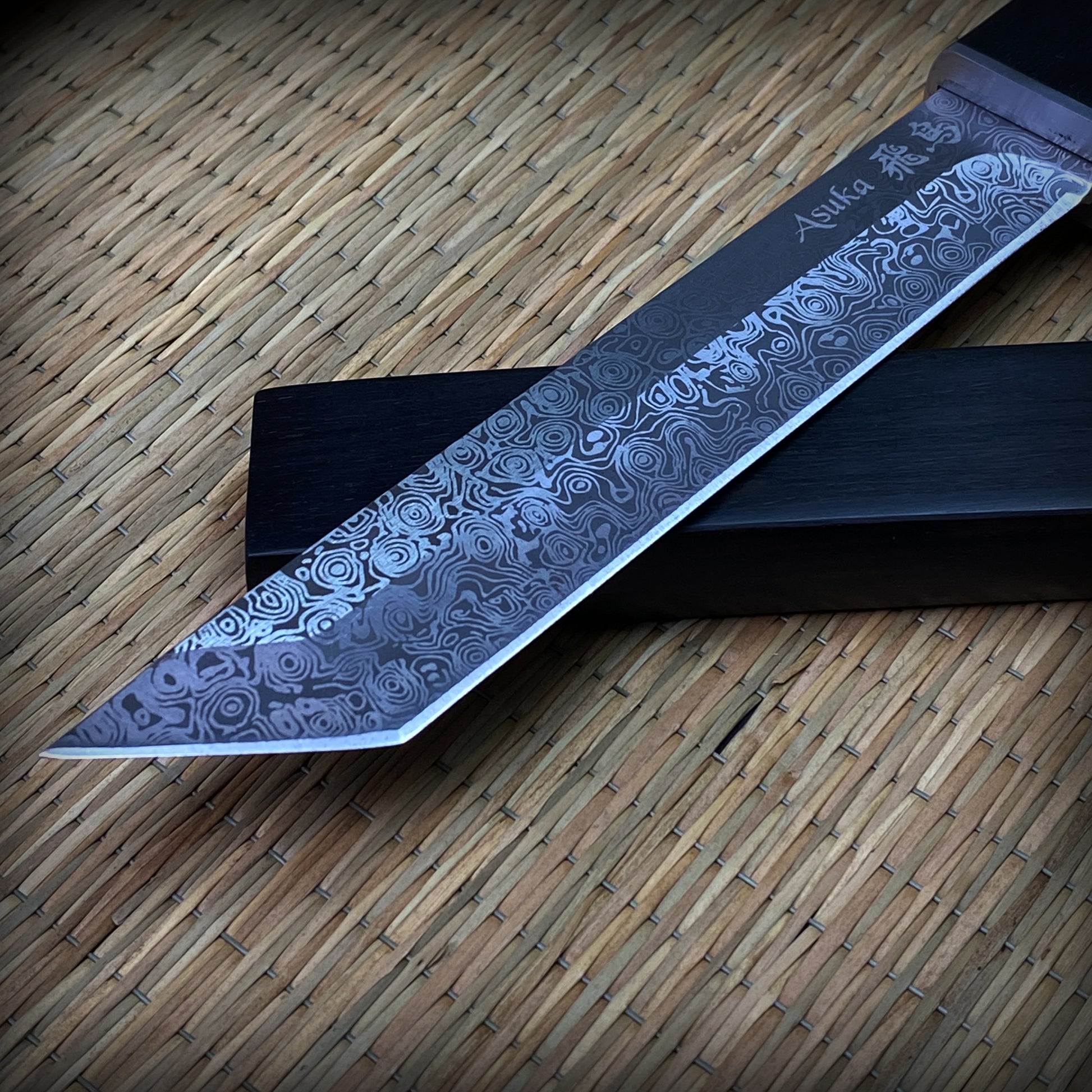 Asuka Suterusu Modern Tanto Knife with intricate damascus blade design and sharp edge