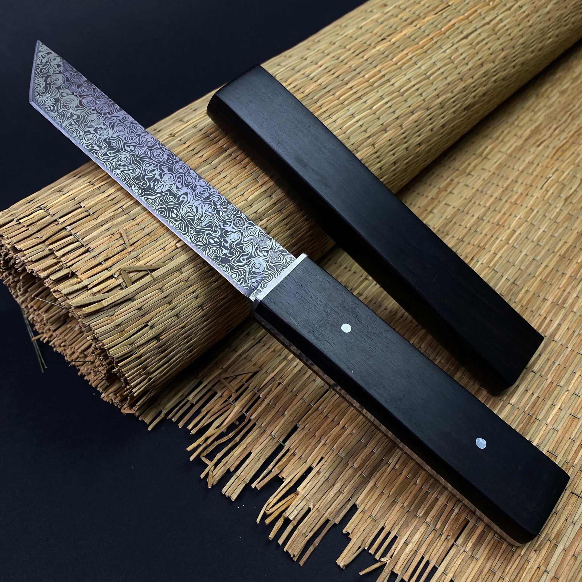 Asuka Suterusu Modern Tanto Knife with intricate blade design and sleek black handle