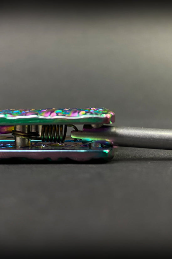 Close-up of the Big Boy Rainbow Butterfly Knife Balisong Trainer showing its vibrant colors and design