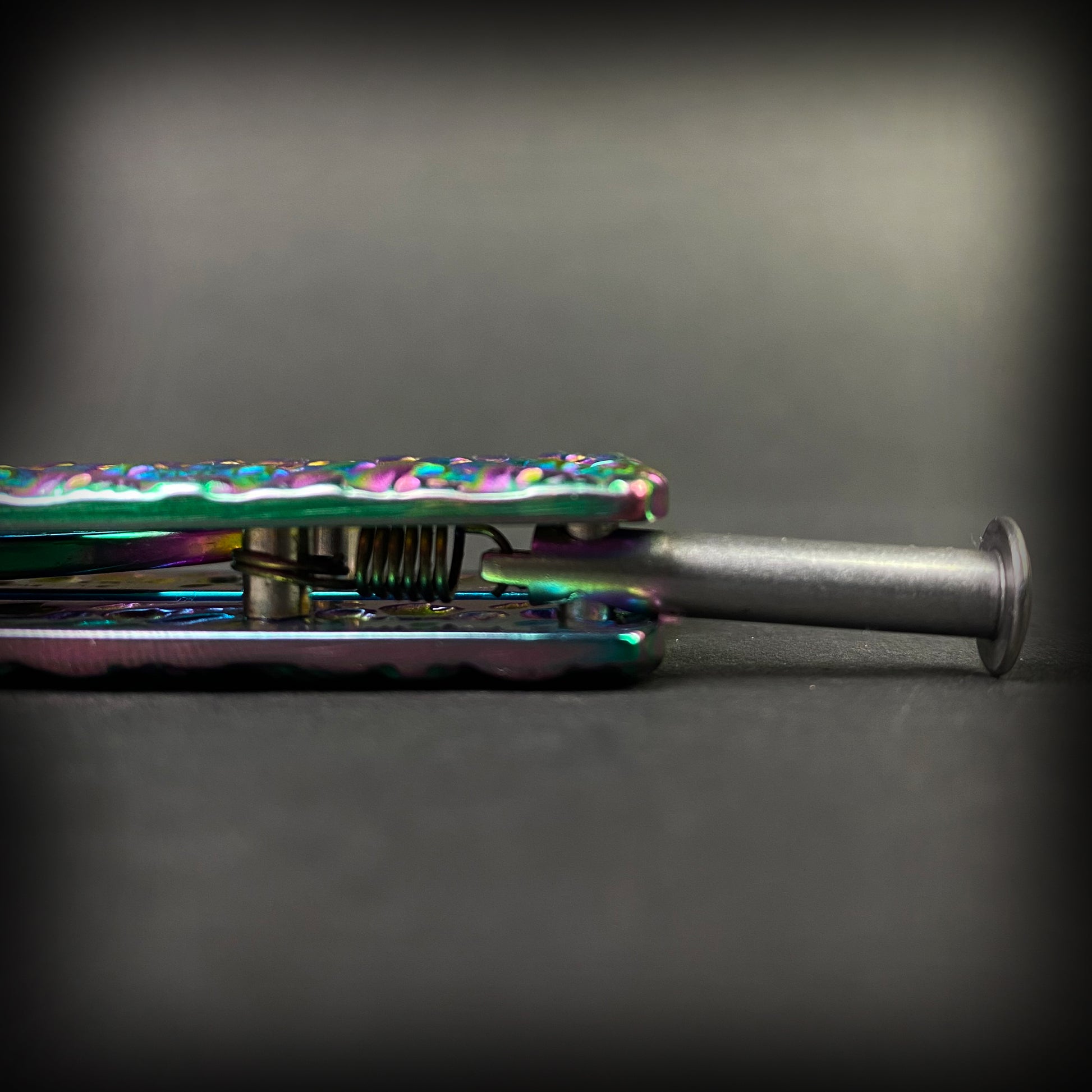 Close-up of the Big Boy Rainbow Butterfly Knife Balisong Trainer showing its vibrant colors and design