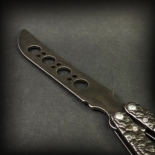 Big Boy's Black Butterfly Trainer featuring a sleek design and multiple practice holes for skill building