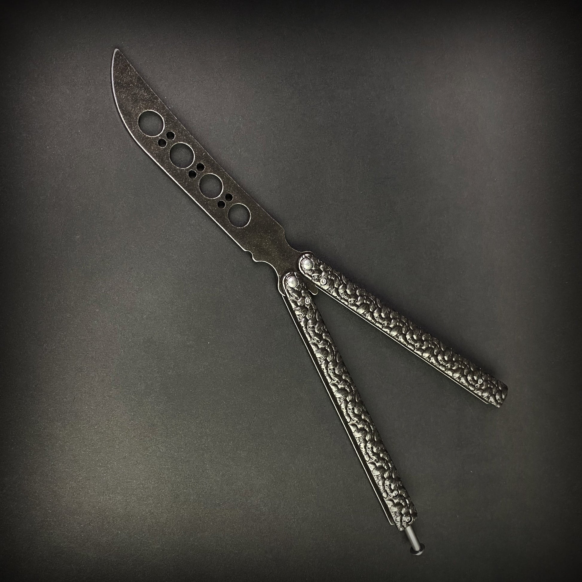 Big Boy's Black Butterfly Trainer with textured handles for safe flipping practice