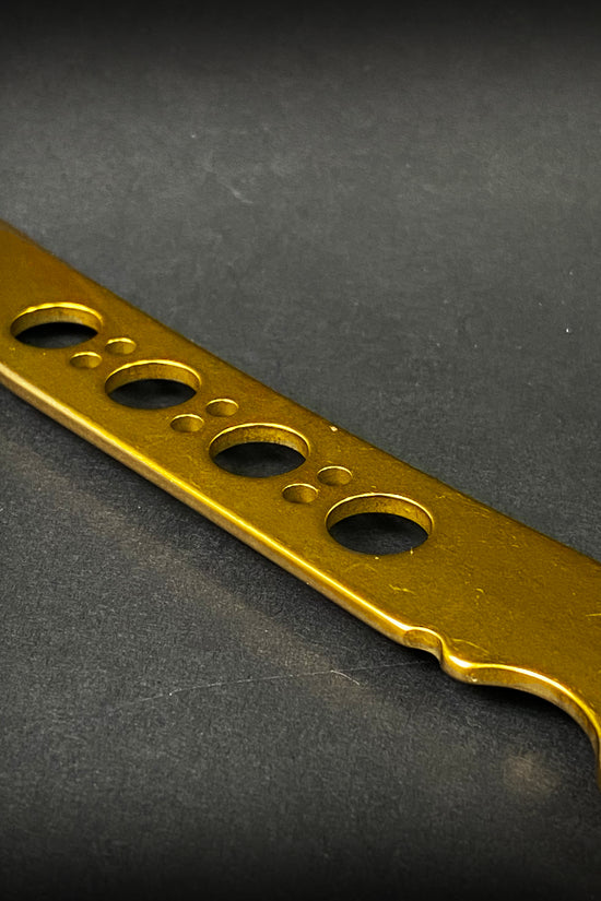 Big Boy's Gold Butterfly Trainer with a shiny blade and multiple safety holes for practice and training
