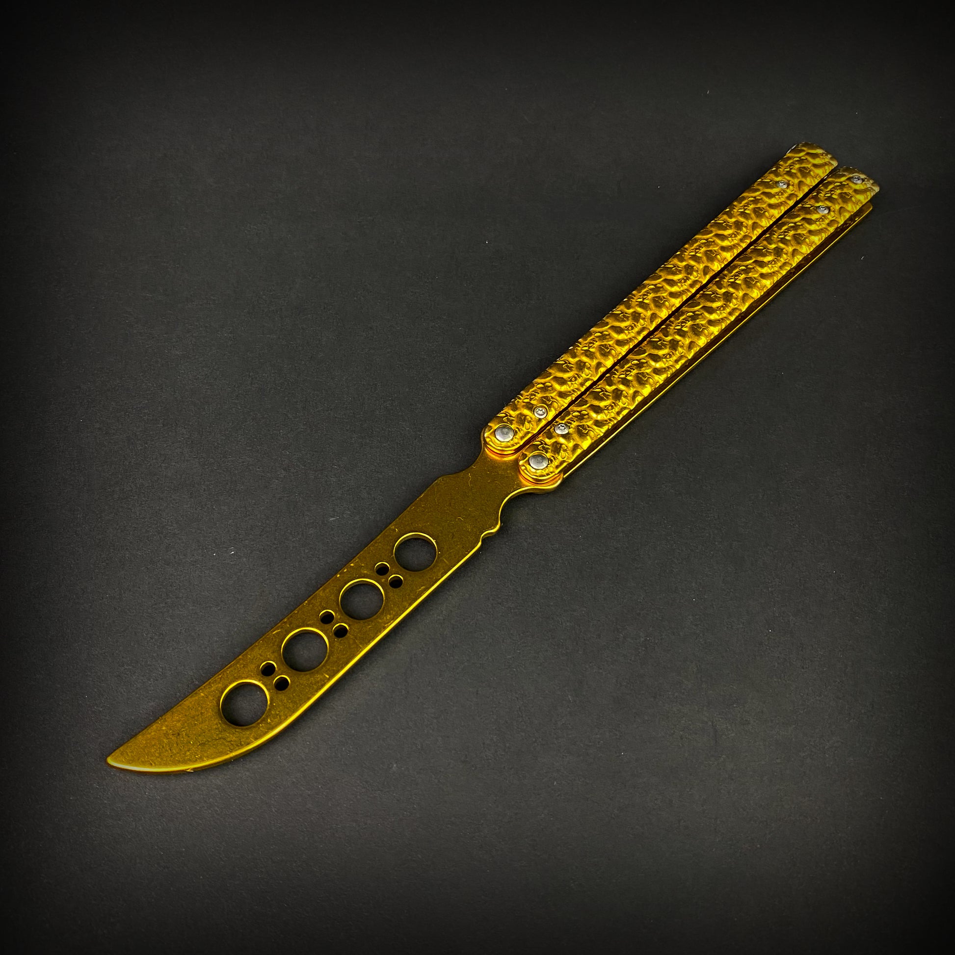 Big Boy's Gold Butterfly Trainer with textured handles for safe flipping practice