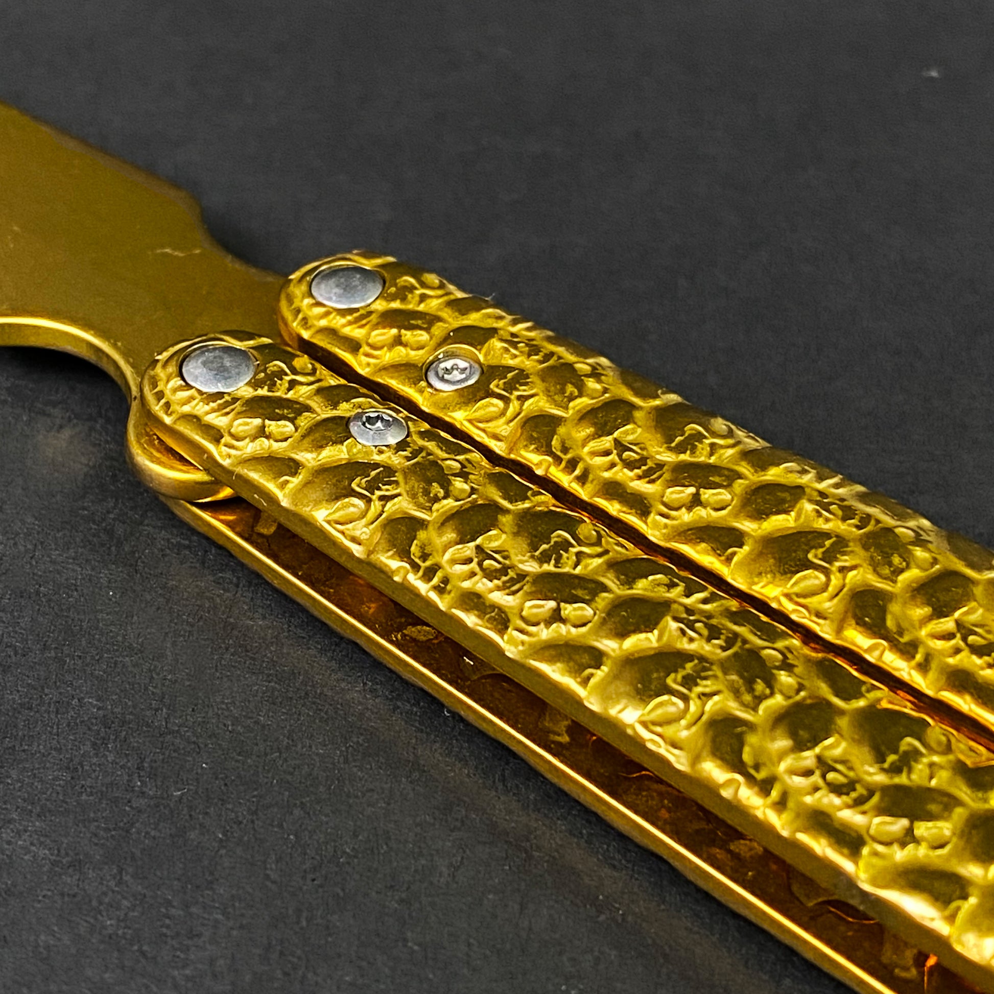 Big Boy's Gold Butterfly Trainer with a textured gold handle for practicing flipping techniques