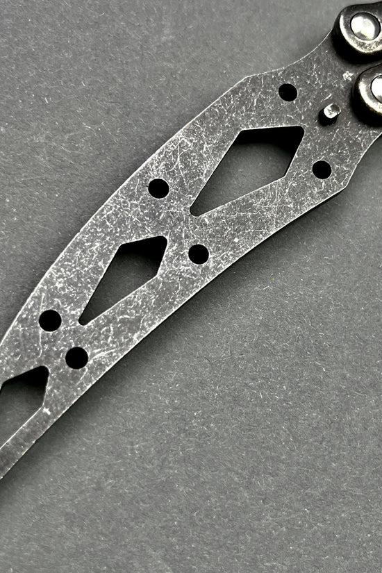 Guild Arms black butterfly trainer knife with scratched metal blade and cutout design