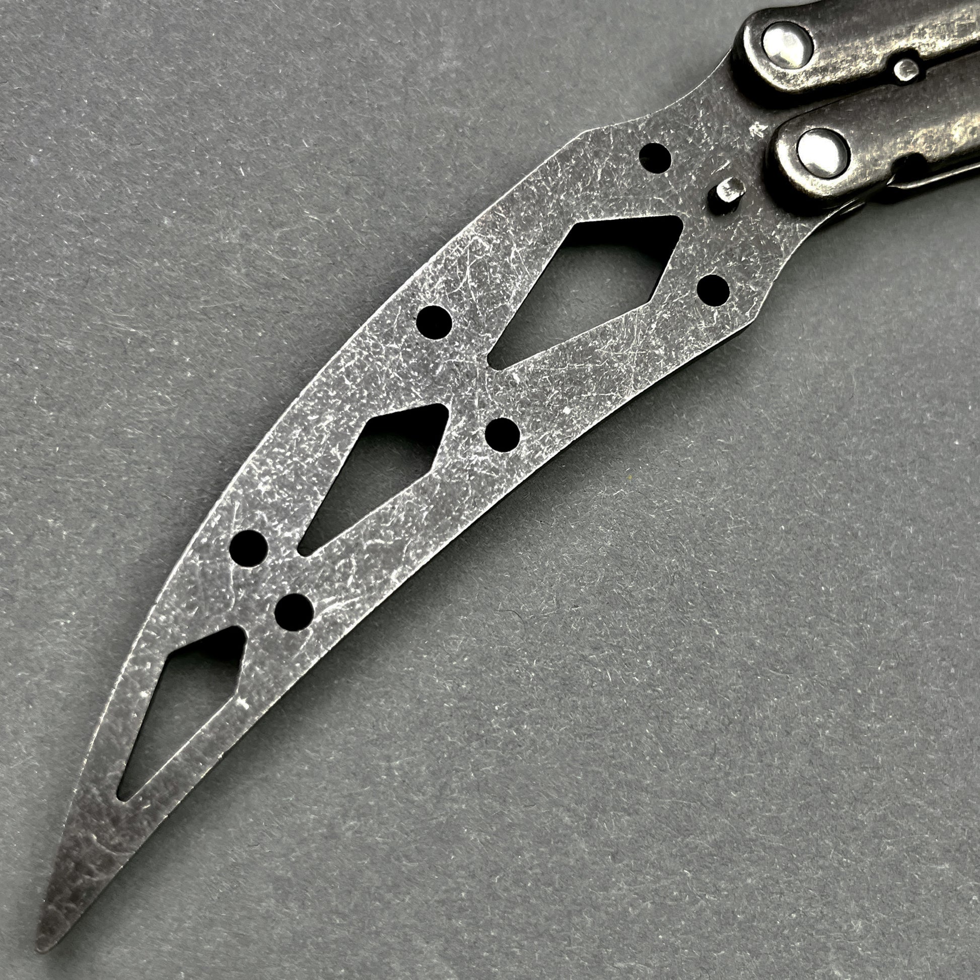 Guild Arms black butterfly trainer knife with scratched metal blade and cutout design