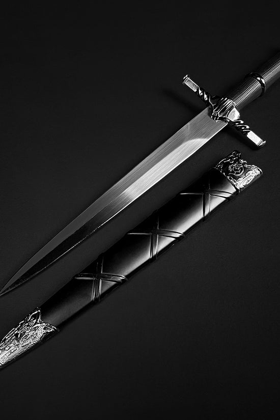 Black medieval dagger w/Black Plastic Scabbard by Guild Arms featuring an ornate hilt and sleek blade