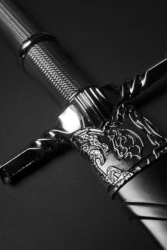 Black medieval dagger w/Black Plastic Scabbard featuring an ornate handle and metallic finish