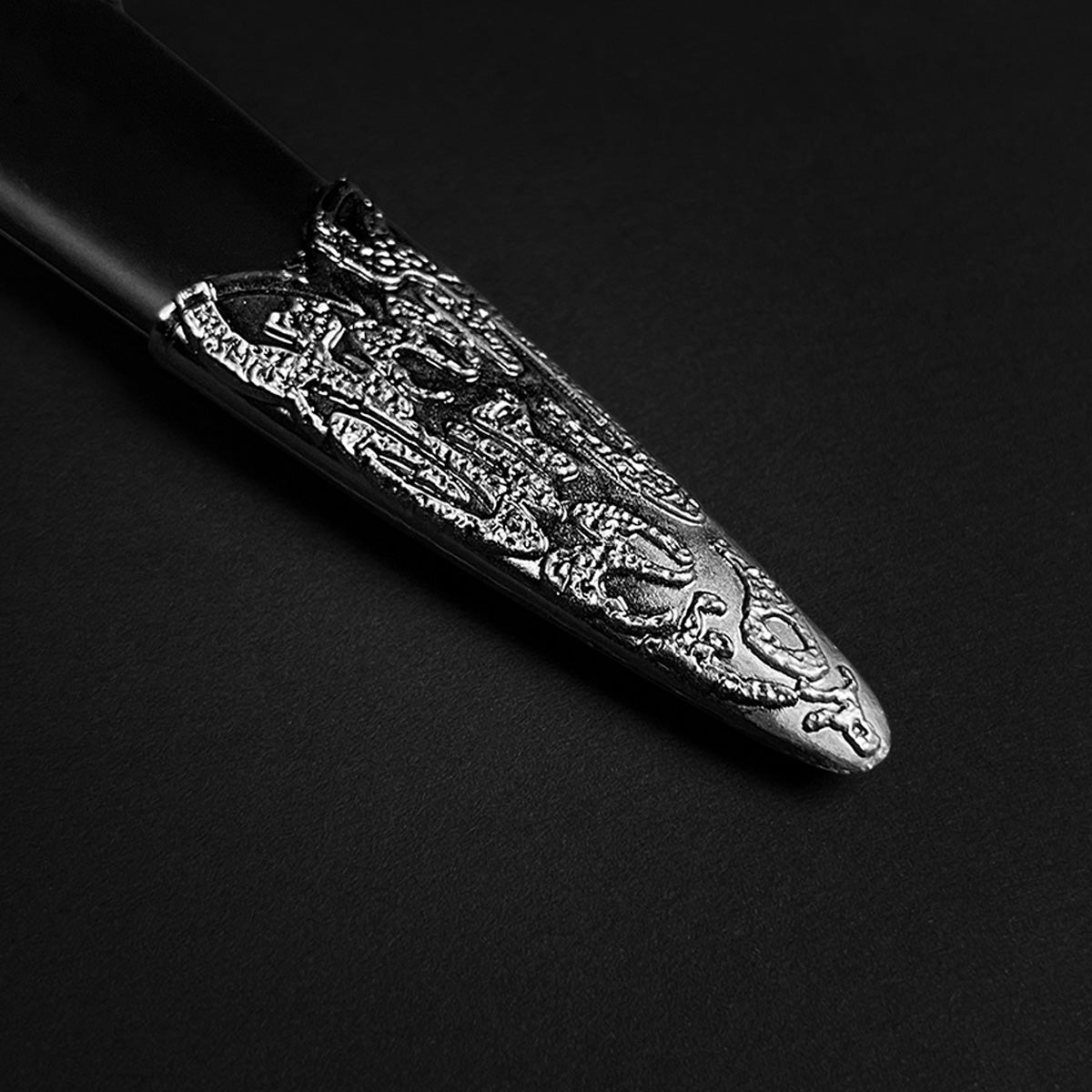 Black medieval dagger w/Black Plastic Scabbard with detailed ornate design on the blade tip