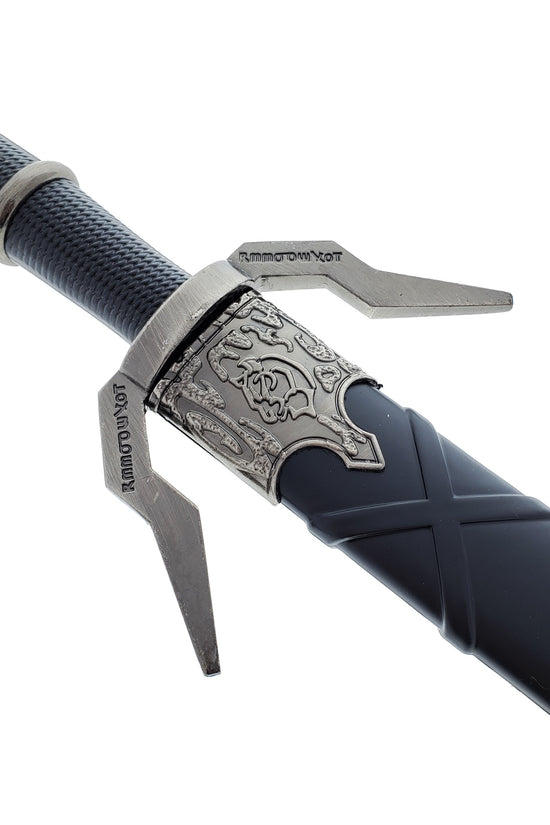 Black Medieval Sword w/Black Plastic Scabbard featuring ornate guard and textured grip