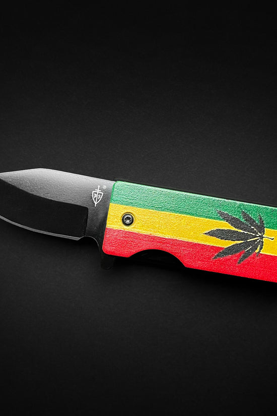 Guild Arms Lighter Case marijuana pocket knife with Rasta red yellow green handle and black drop point blade