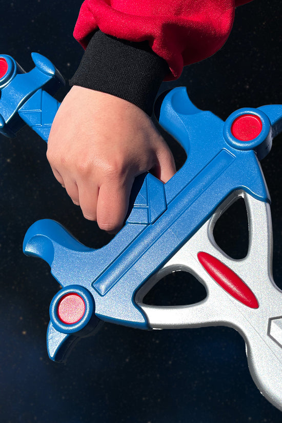 Blazing Sword Cosplay Foam Sword held by a person in a red outfit with detailed blue and silver design