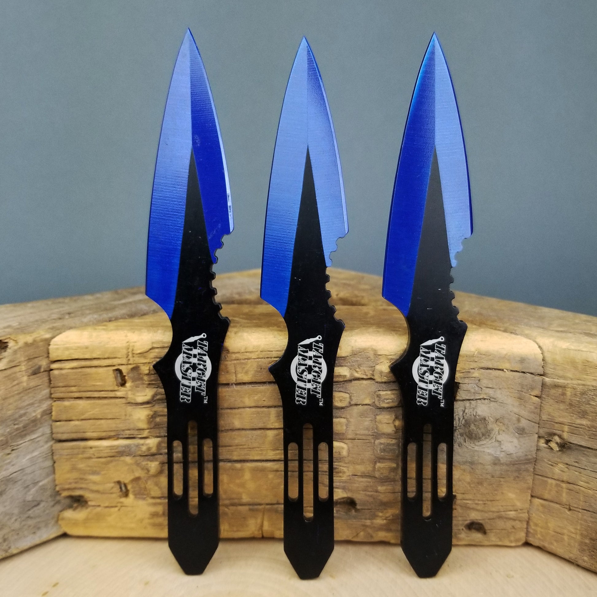 Blue throwing knives set featuring three sleek blades with serrated edges and ergonomic handles