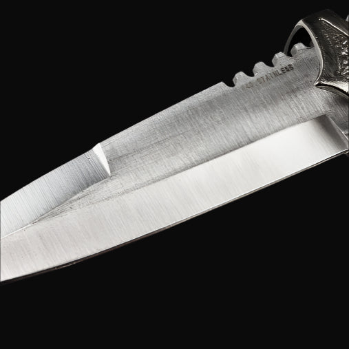 Guild Arms Blue Scottish Dirk Dagger close up stainless steel blade with serrations and engraved guard