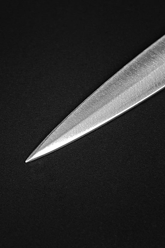 Detailed view of a Classic Medieval Dagger blade with a sharp pointed tip and polished finish