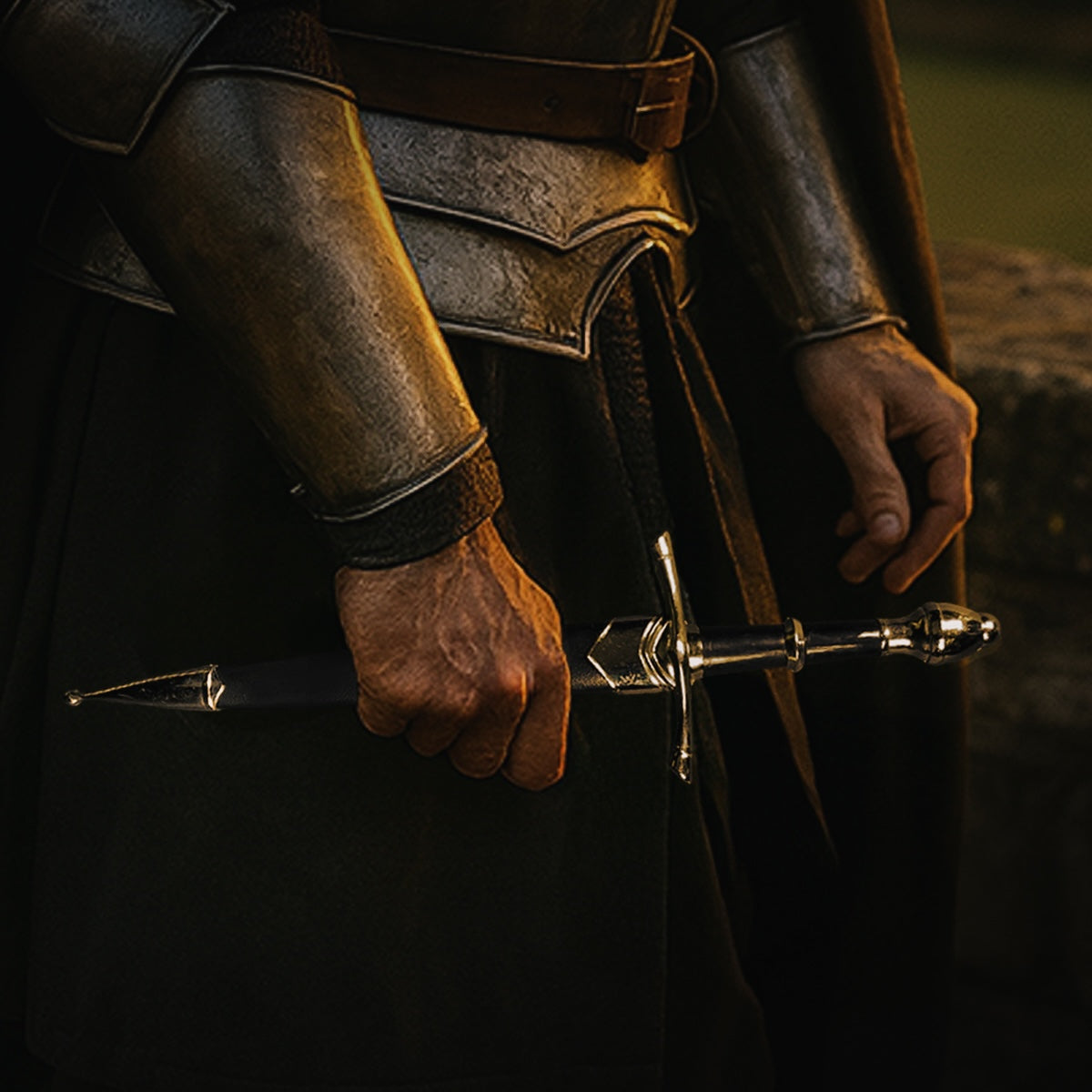 Classic Medieval Dagger by Guild Arms with a sleek design and ornate detailing, held firmly in a warrior's hand