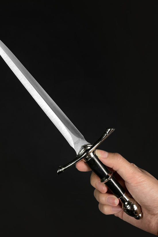 Classic Medieval Dagger with a sleek blade and elegant handle held by a hand