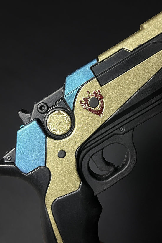 Otaku Gear cosplay foam pistol gun in gold black and blue with detailed emblem on the side