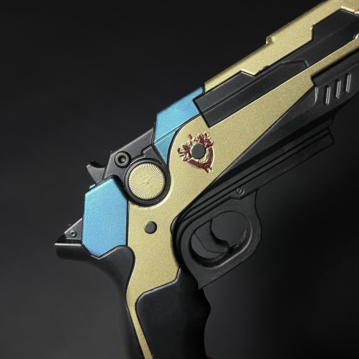 Otaku Gear cosplay foam pistol gun in gold black and blue with detailed emblem on the side
