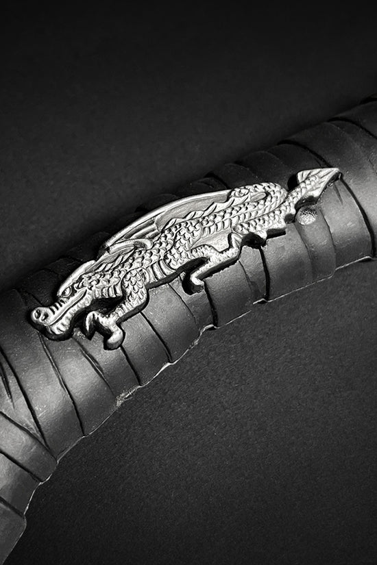 Close-up of the handle of a decorative Fire Dragon Axe with Stand featuring intricate dragon design