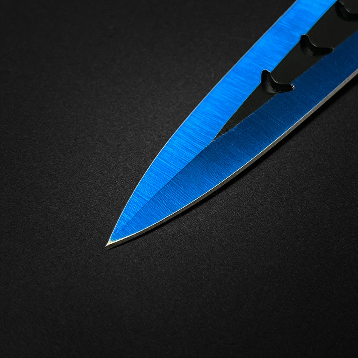 Close-up of Falcon 6 PC Blue Throwing Knives Set with sleek blue finish and sharp blades