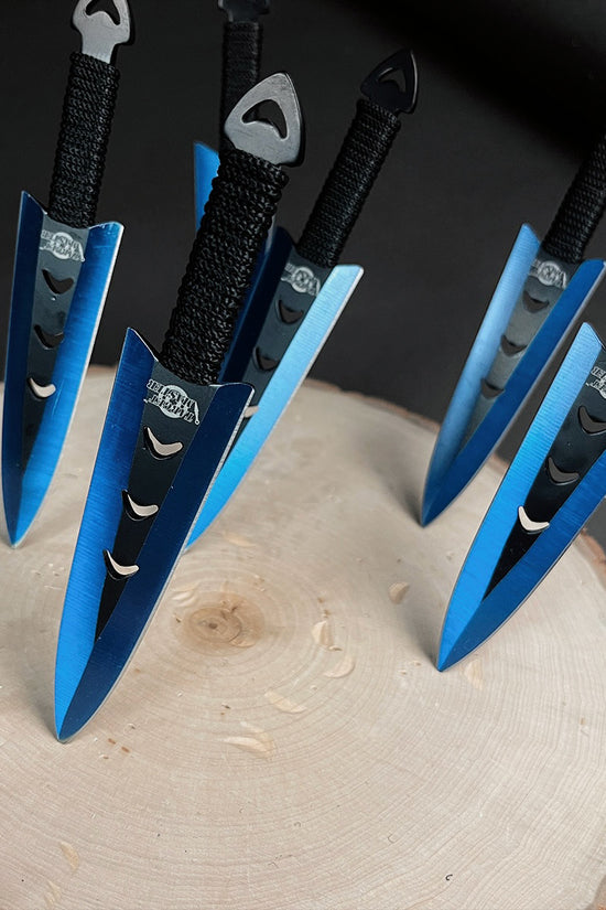 Falcon 6 PC Blue Throwing Knives Set stylishly displayed on a wooden surface